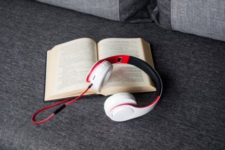 printed book attached to headphones